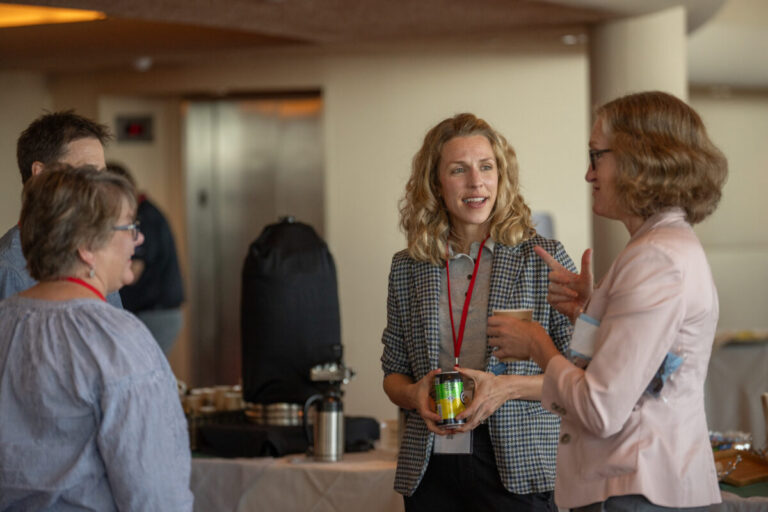 women speaking at a conference