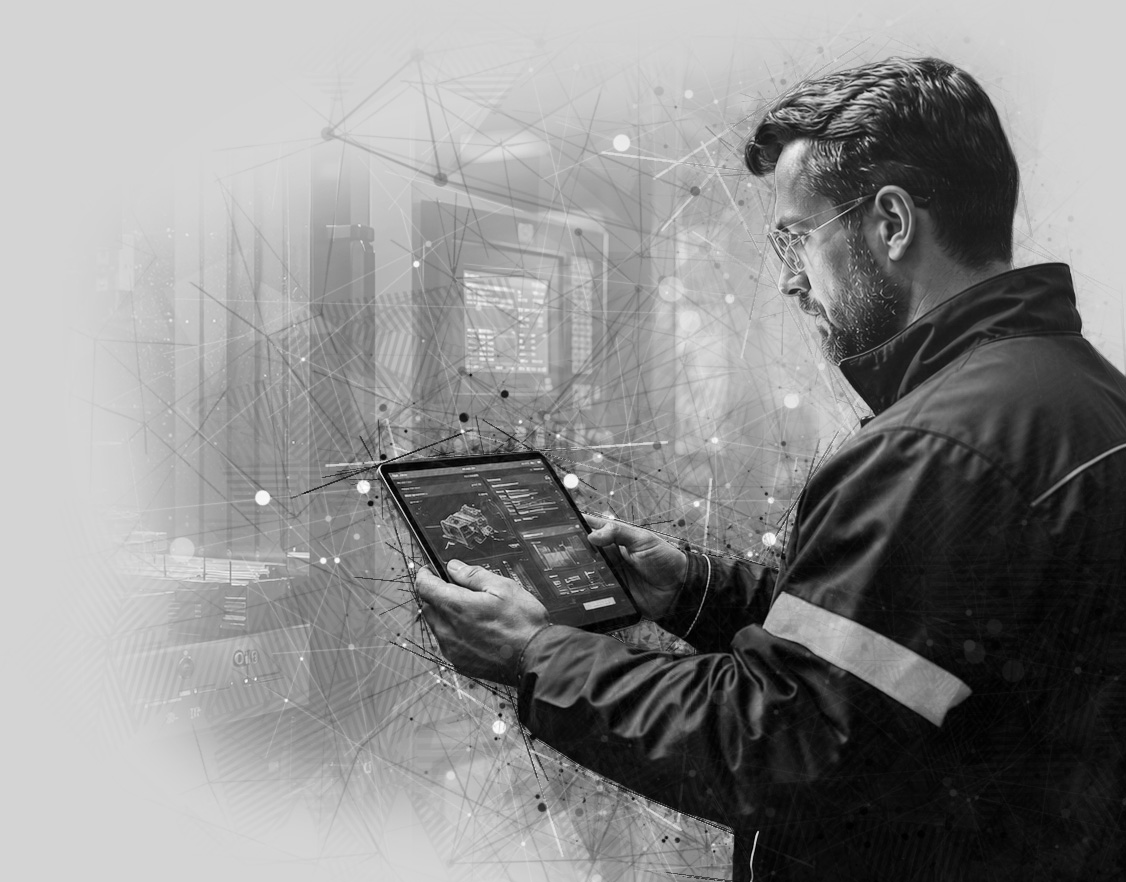 man working on tablet in factory